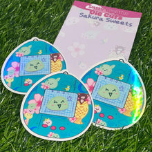 Load image into Gallery viewer, Tamogotchi mochi sticker, holo finish mochi sticker, tamagotchi style sticker, planner sticker, mochi sticker